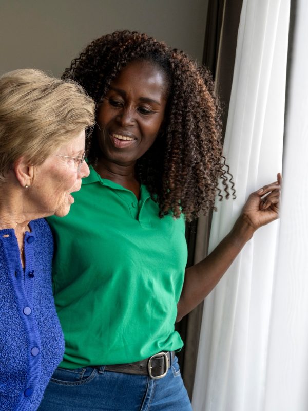 Helper caring for elderly lady